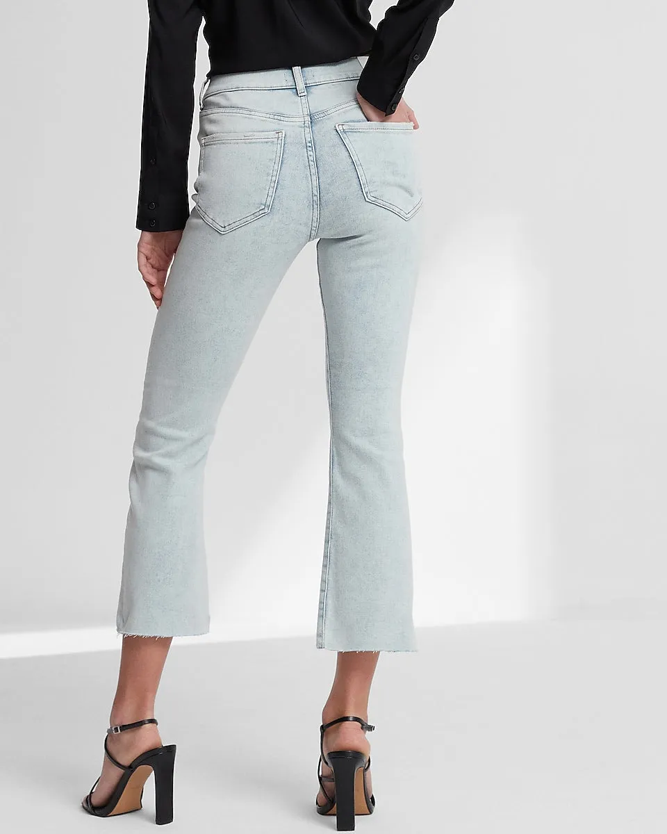 High Waisted Light Wash Raw Hem Cropped Flare Jeans in Light Wash
